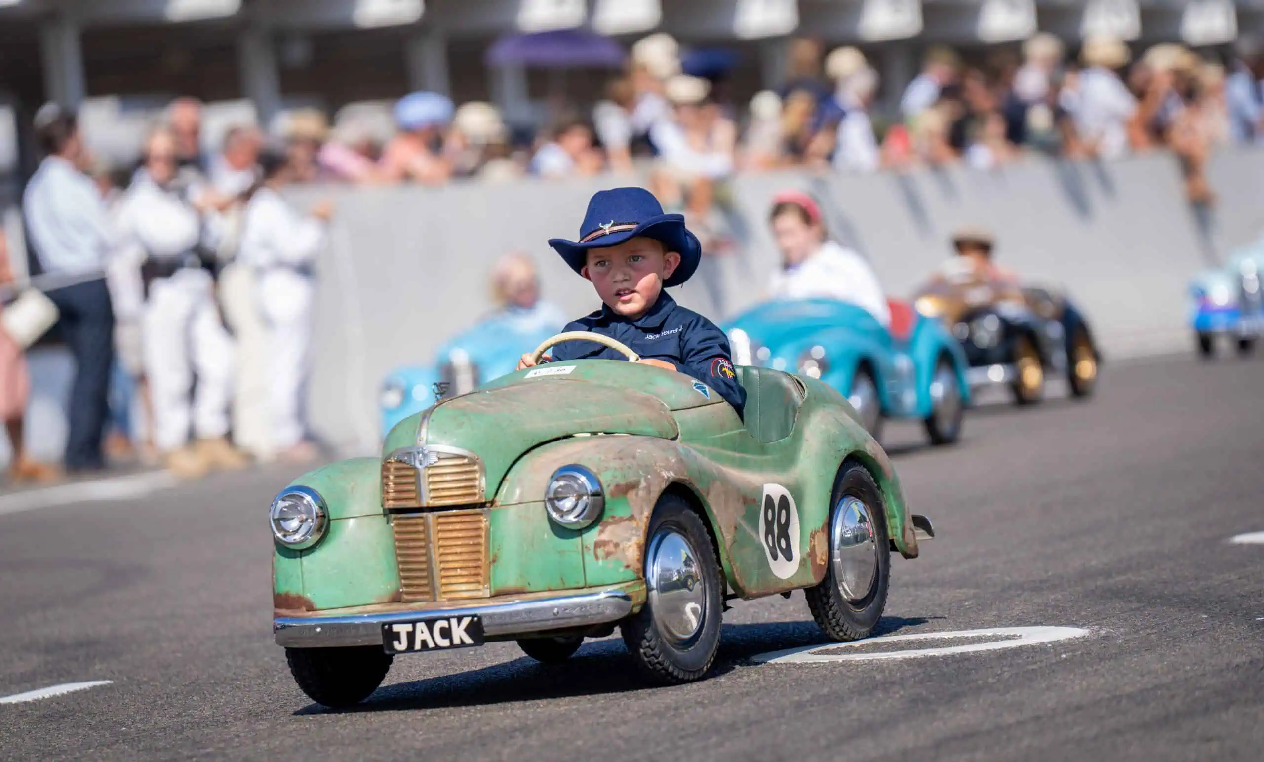 Child Riding Car Scaled