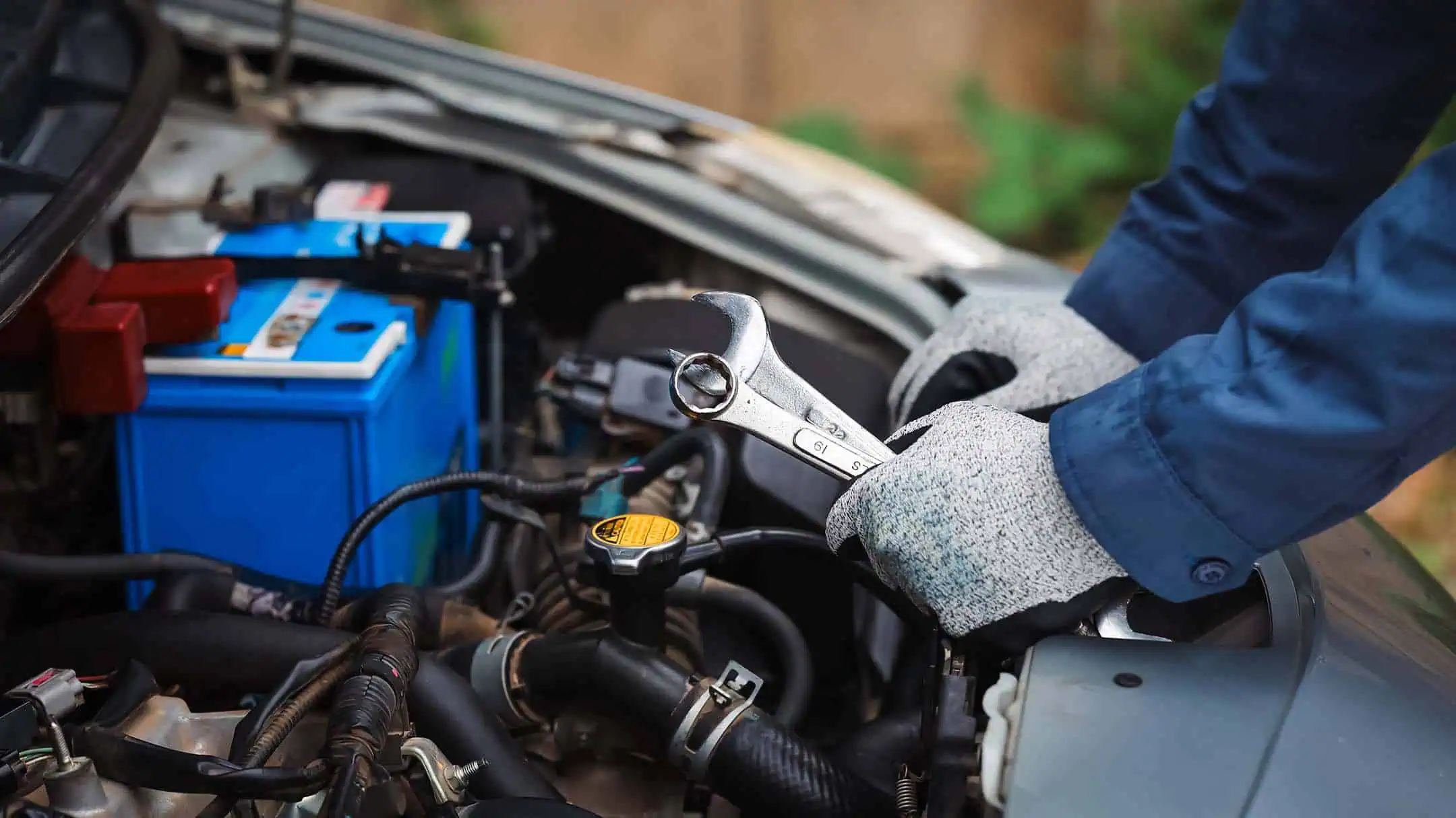 Mechanic Inspecting Bonnet