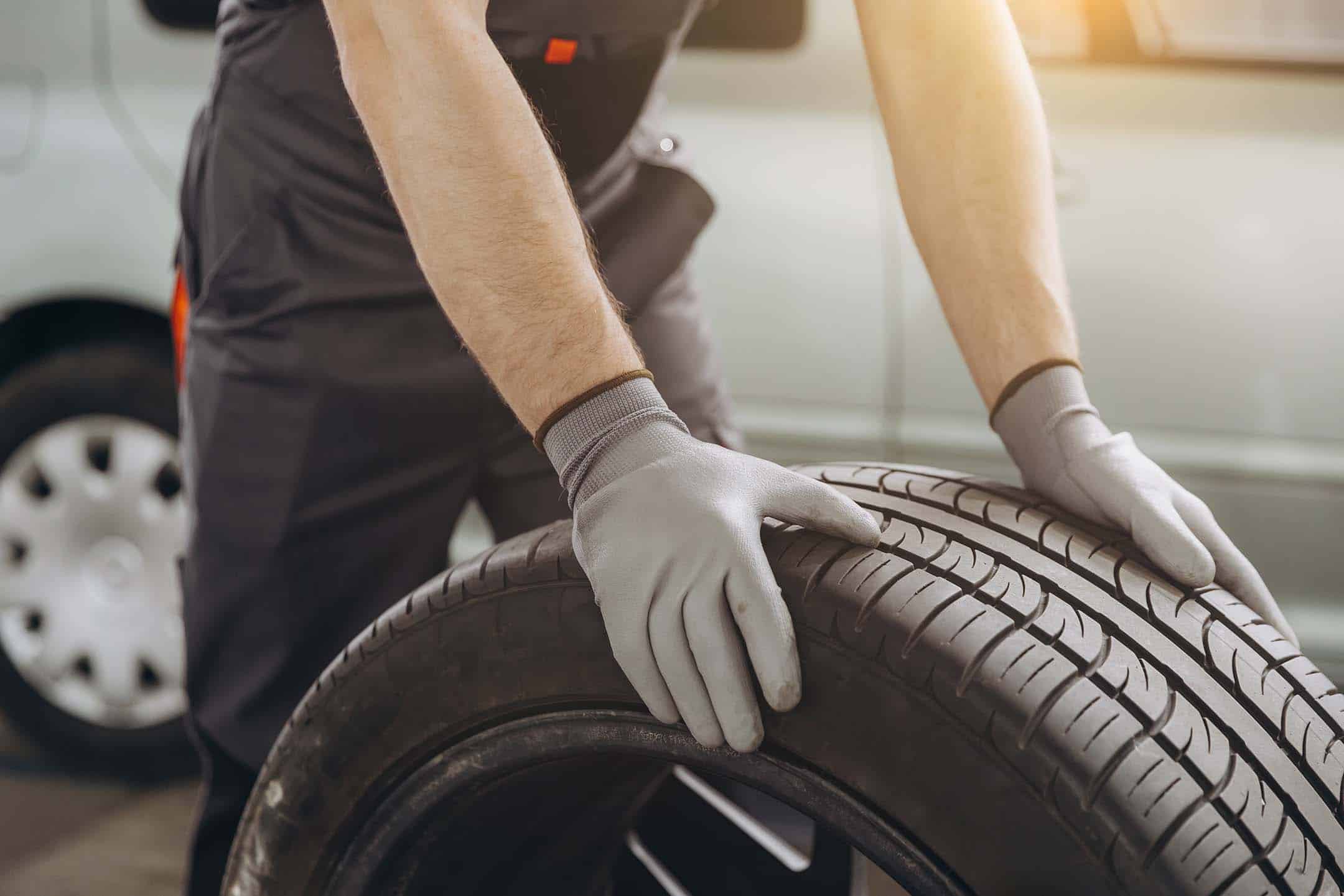 Mechanic With Tyre