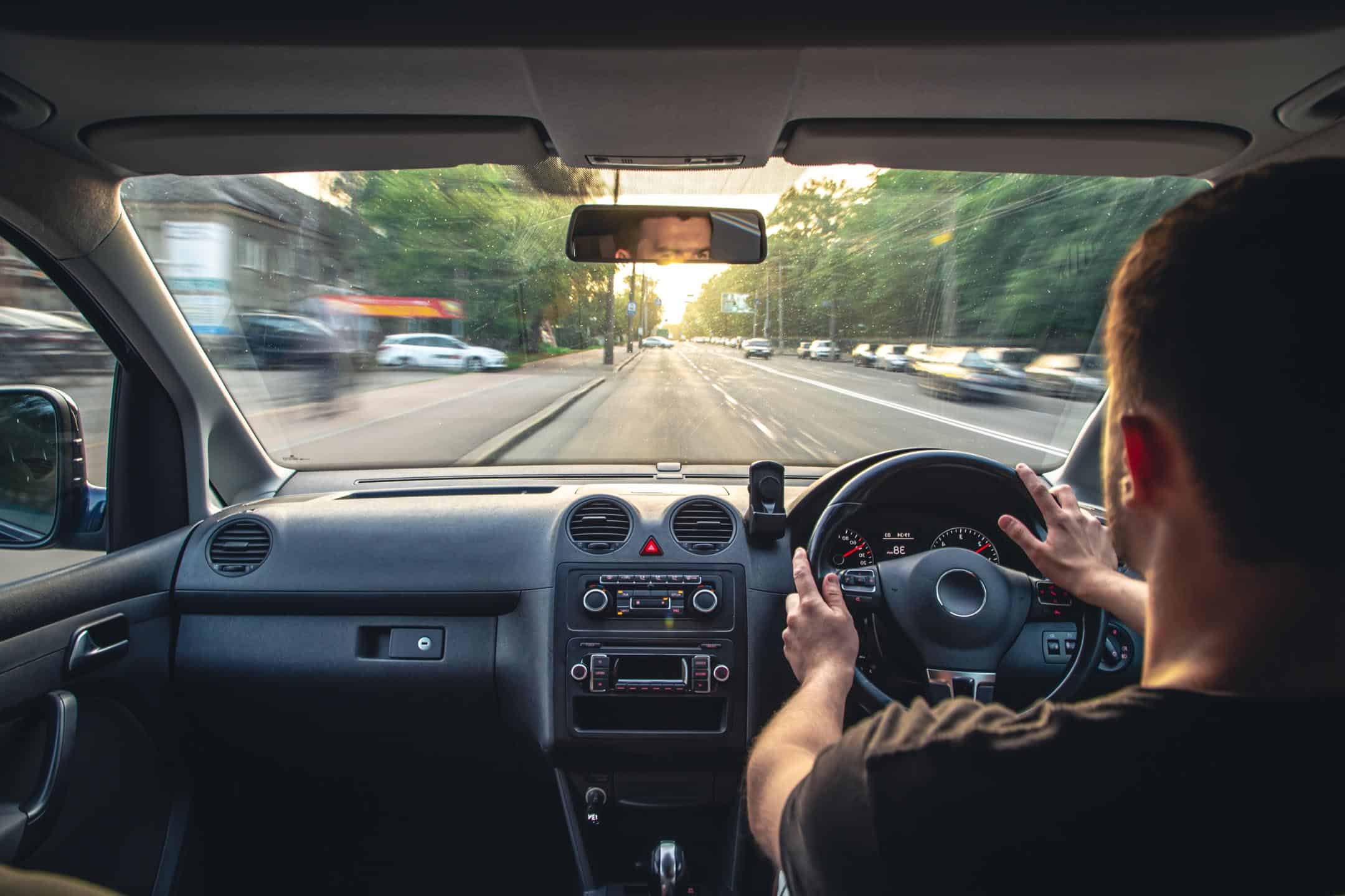 Pov Man Driving Looking Ahead Through Windscreen