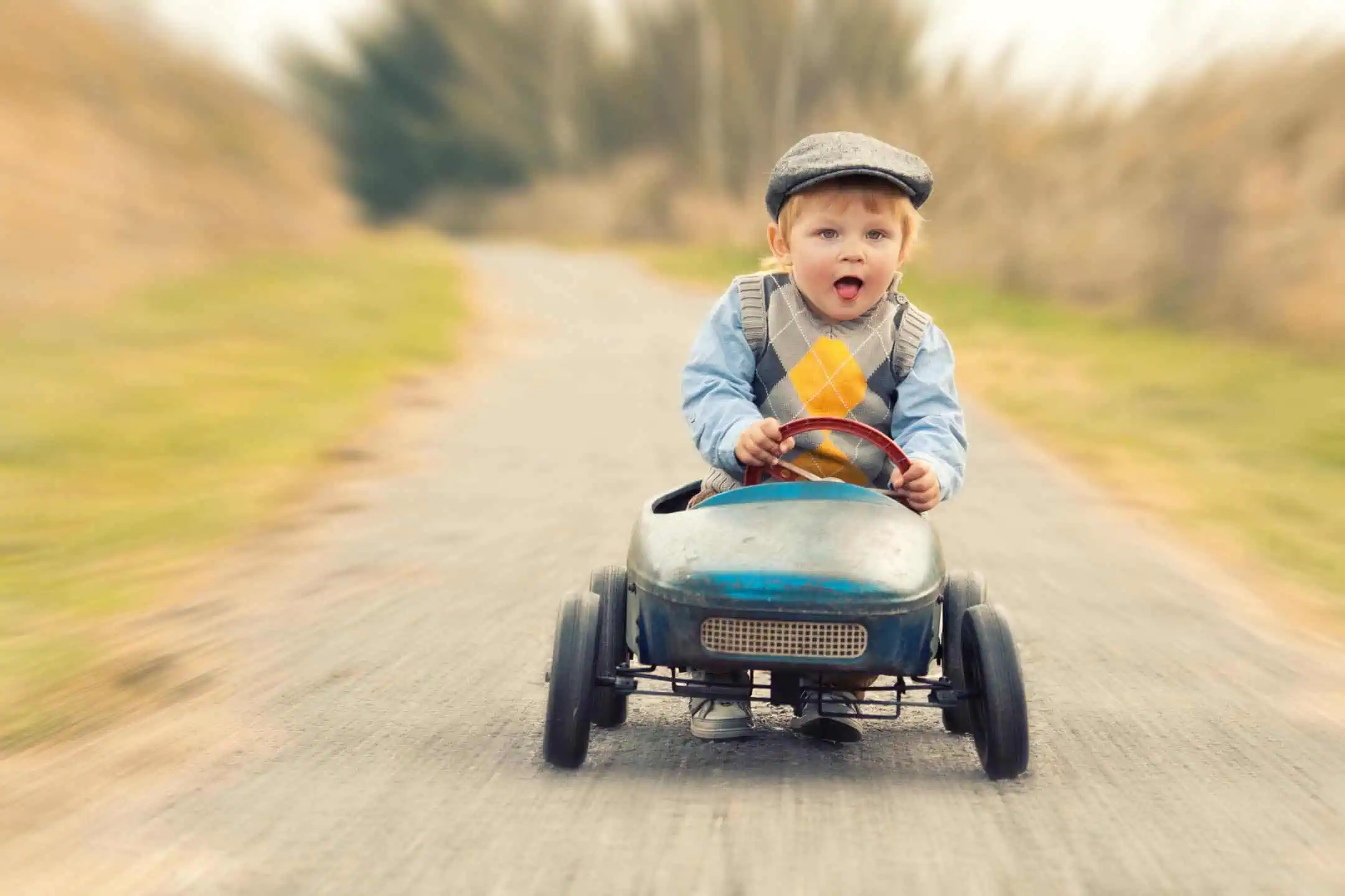 Boy In Toy Car