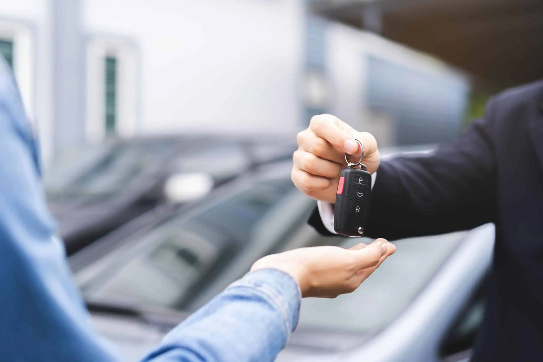 Car Dealer Handing Car Keys Over