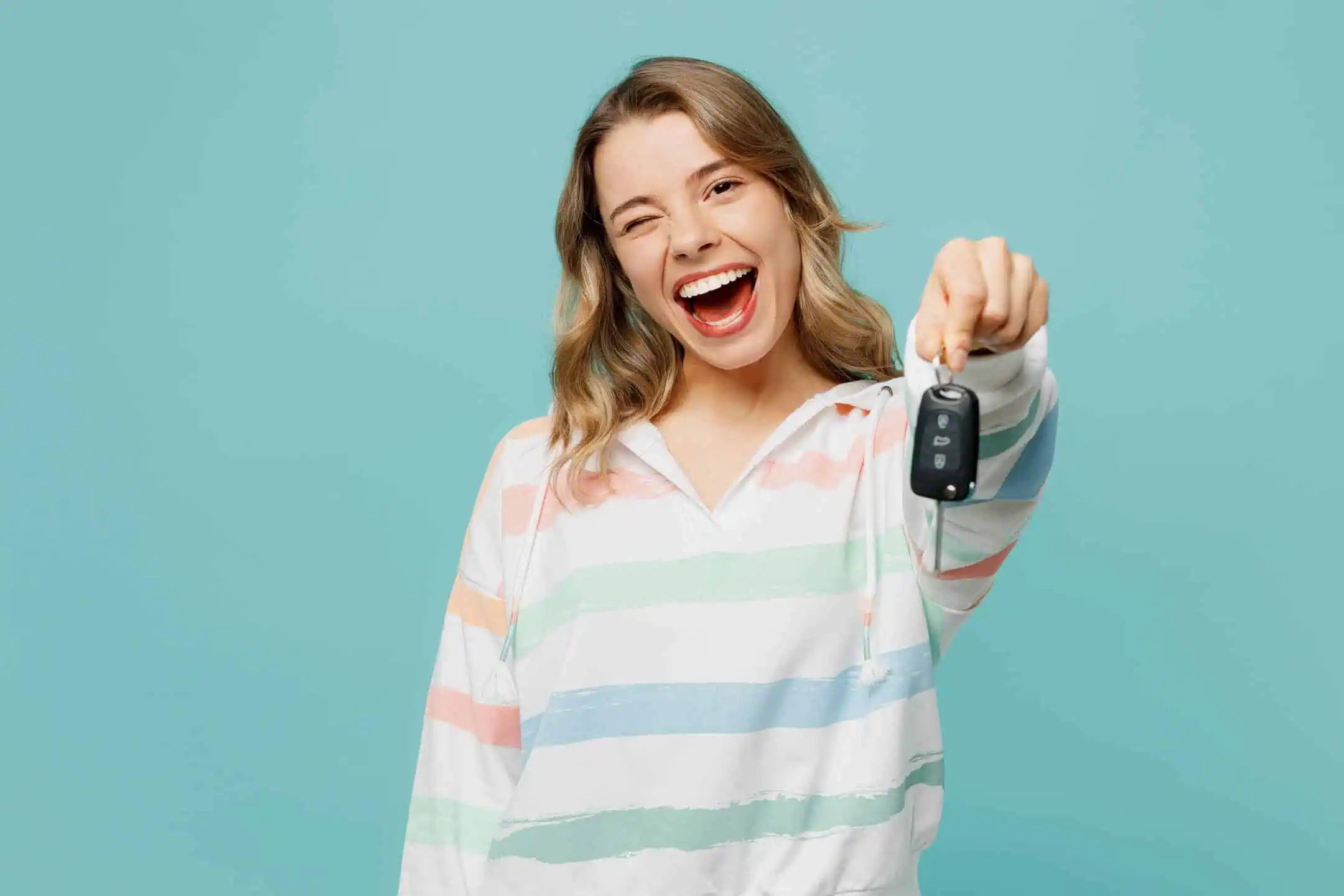 Girl Winking Holding Keys With Blue Background