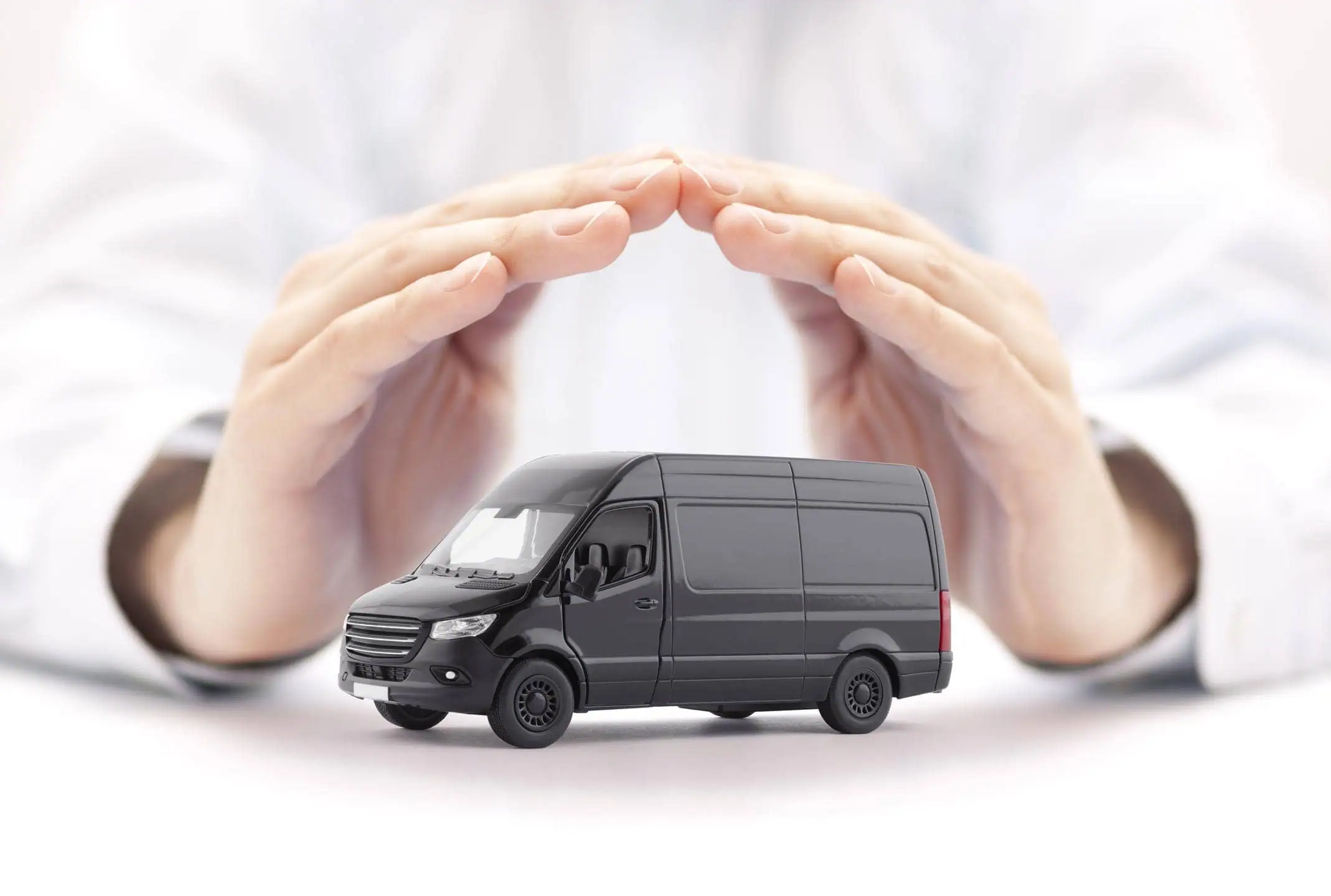 Hands Sheltering Toy Van