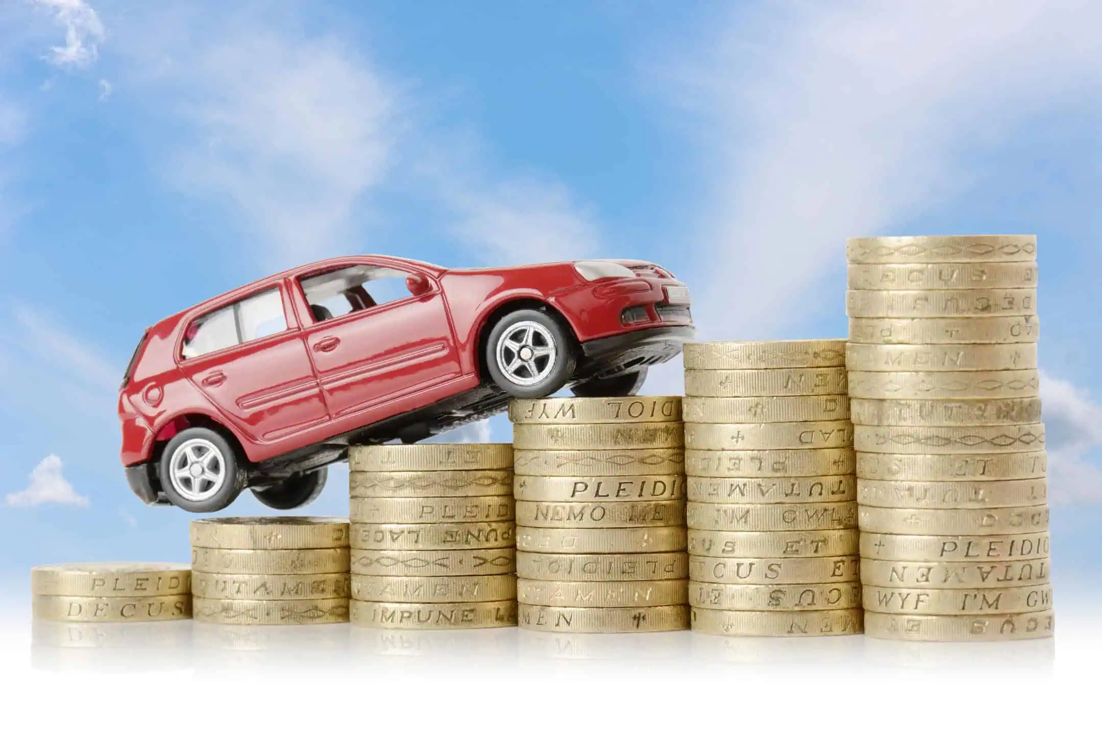 Red Car Driving Up Uk Pound Coins